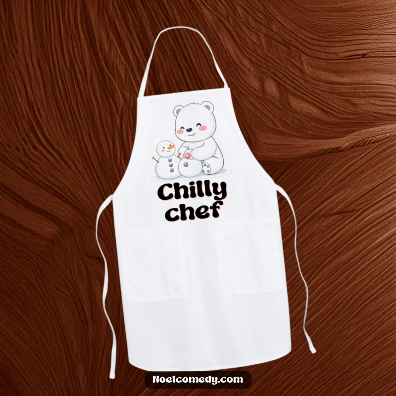 Funny apron featuring a happy polar bear building a small snowman with sparkly buttons, ideal for winter kitchen activities.
