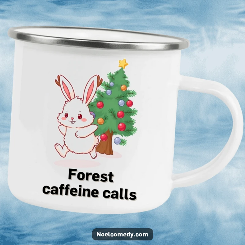 Funny Camping Mug showing a fluffy bunny with antlers hopping near a decorated evergreen, perfect for nature lovers.
