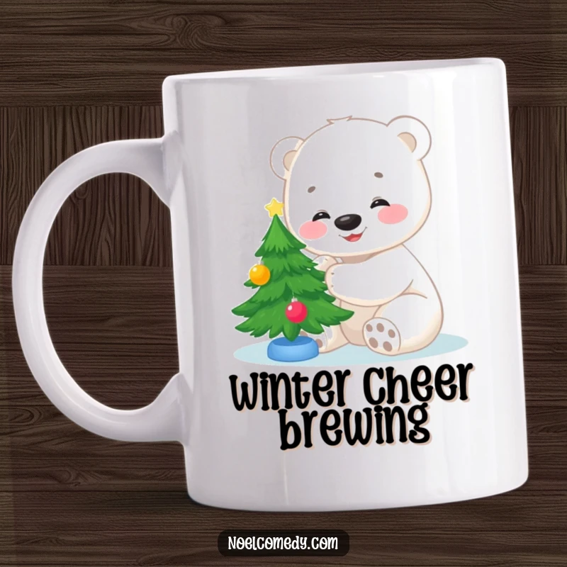 Funny mug featuring a smiling polar bear cub happily decorating a tiny Christmas tree with ornaments and a star on top.