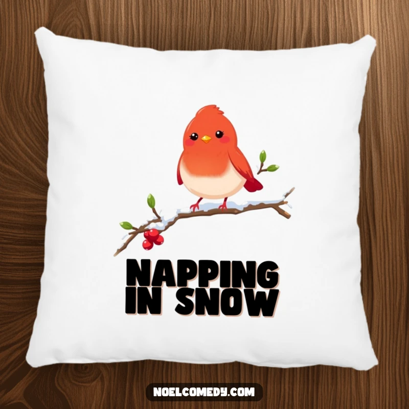 Funny red robin pillow with a cheerful bird on a snowy branch, offering comfort and festive winter charm.