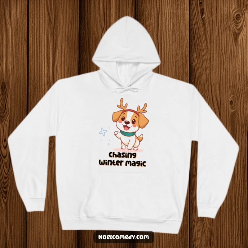 Funny Hoodie featuring a happy dog adorned with a reindeer headband, chasing a snowflake in winter fun.