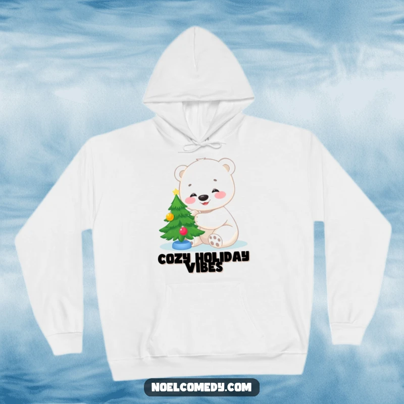 Funny hoodie design featuring a happy polar bear cub cheerfully decorating a small Christmas tree, evoking warmth and holiday magic.