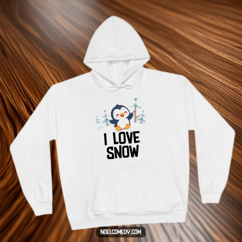 Funny Hoodie showing a giggling penguin gleefully sliding down a snowy hill, perfect for cozy winter moments.