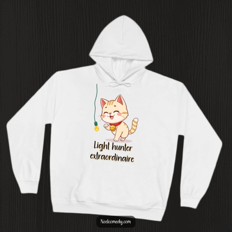 Funny Hoodie featuring a smiling cat with a bell collar, playfully batting at a dangling Christmas light.