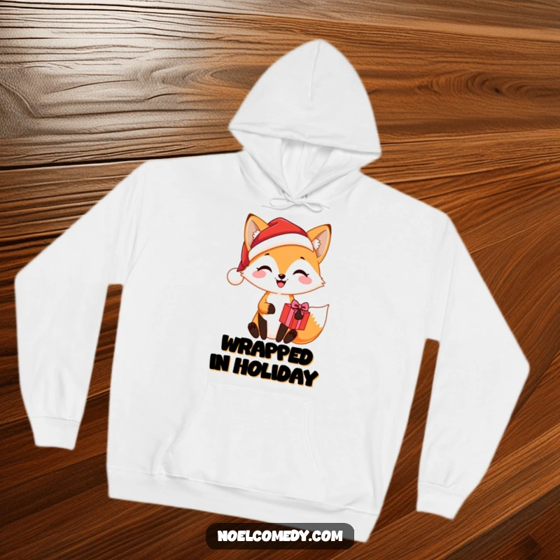 Funny hoodie design featuring a cheerful fox wearing a Santa hat, holding a holiday present, perfect for staying warm and festive.