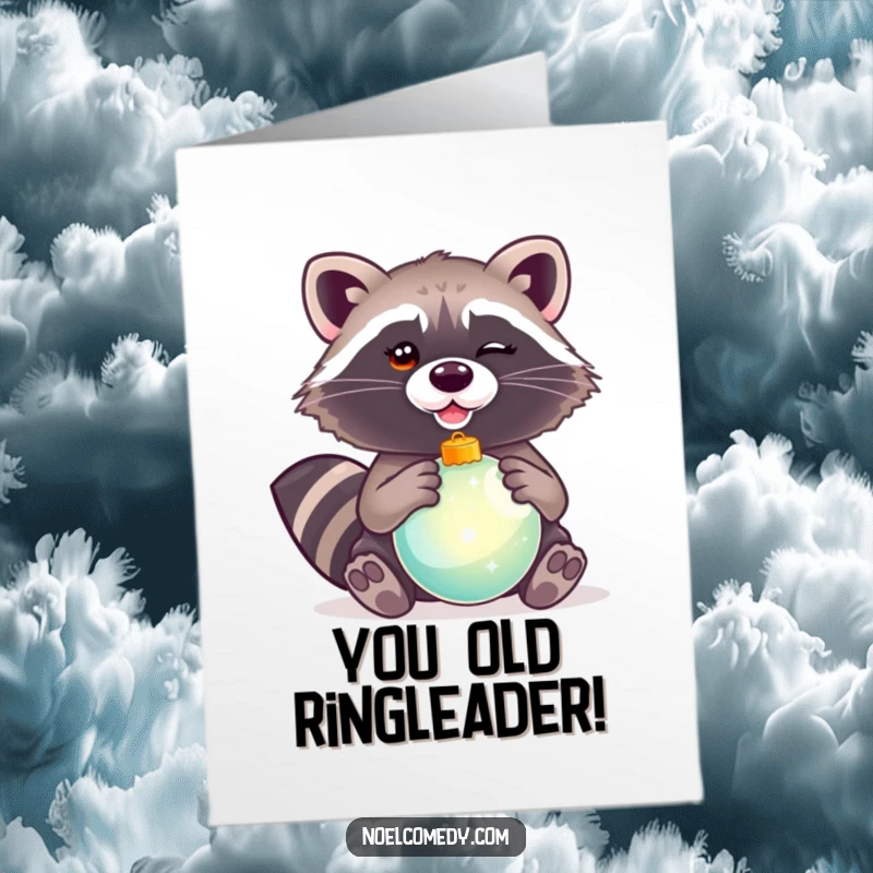 Funny Free Printable Birthday Card: A mischievous raccoon winking slyly while holding a shiny, festive ornament, perfect for birthdays.