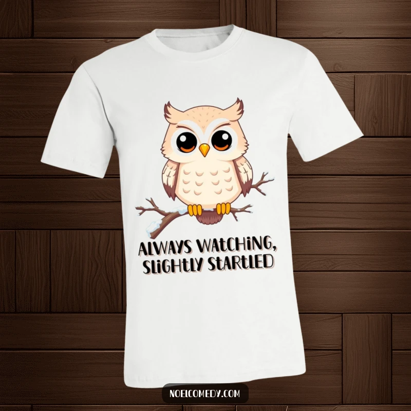 Funny t-shirt with a happy owl with wide eyes on a snowy branch, showcasing curiosity and winter charm. Great for bird watchers.