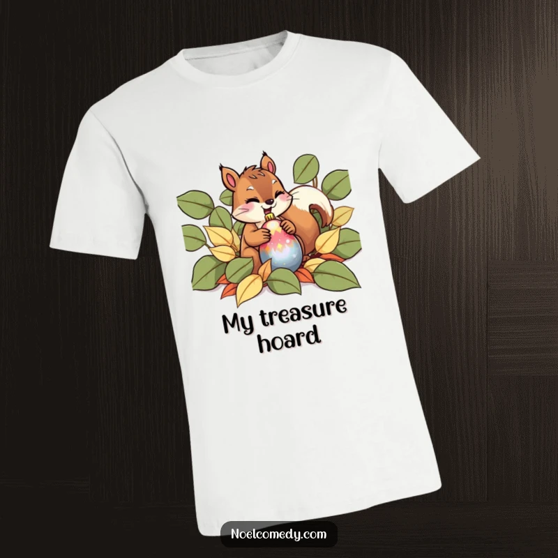 Funny T-Shirt with a giggling squirrel concealing a shiny ornament amidst fallen leaves, embodying holiday fun.