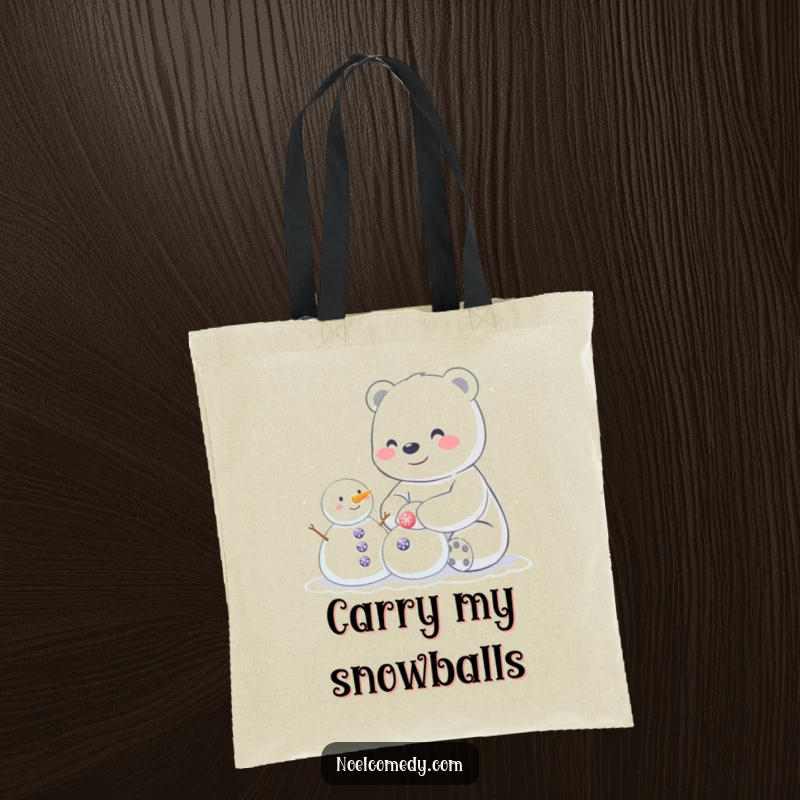 Funny tote bag showcasing a happy polar bear building a small snowman adorned with sparkly buttons, ideal for carrying winter essentials.