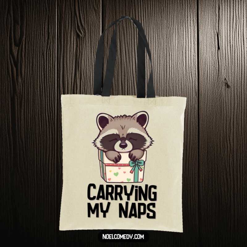 Funny Sleepy Raccoon Tote Bag: A cute raccoon nestled in a gift box, making this tote a charming and humorous accessory.