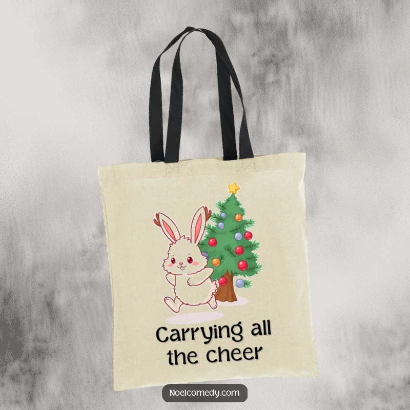 Funny Tote Bag featuring a fluffy bunny with antlers hopping joyfully beside a decorated evergreen, ideal for shopping.